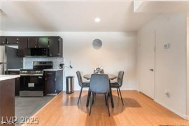 221 Mission Catalina Ln Unit 104, Las Vegas, NV 89107 - dining area featuring light wood-style floors