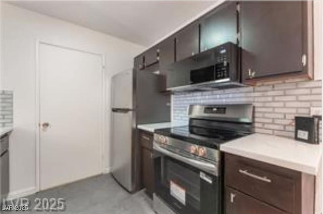 221 Mission Catalina Ln Unit 104, Las Vegas, NV 89107 - kitchen featuring stainless steel appliances, tasteful backsplash, light countertops, and dark brown cabinets