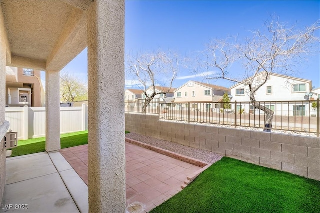 8798 Tom Noon Ave Unit 103, Las Vegas, NV 89178 - fenced backyard featuring a residential view and a patio