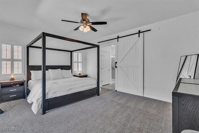 7775 Santos Bay Ct, Las Vegas, NV 89179 - carpeted bedroom with a barn door and ceiling fan
