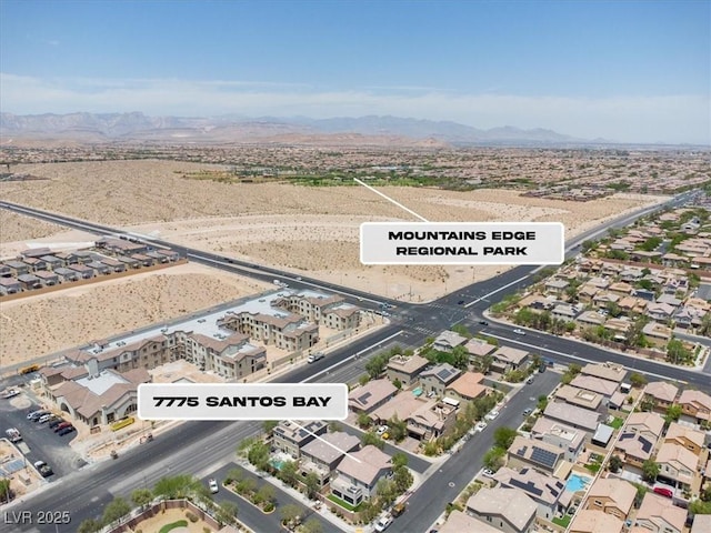 7775 Santos Bay Ct, Las Vegas, NV 89179 - aerial overview of property's location featuring a mountain backdrop and nearby suburban area