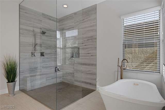 10271 Meridian Hill Ave, Las Vegas, NV 89135 - bathroom with a freestanding tub, a shower stall, plenty of natural light, and tile patterned flooring