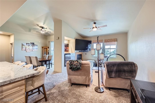 2325 Windmill Pkwy Unit 1622, Henderson, NV 89074 - living area featuring a ceiling fan, light carpet, and vaulted ceiling