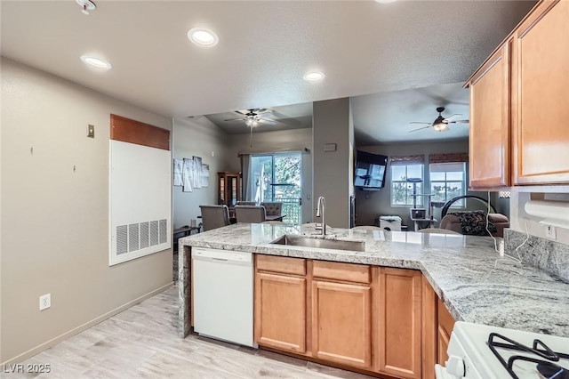 2325 Windmill Pkwy Unit 1622, Henderson, NV 89074 - kitchen featuring white appliances, a ceiling fan, open floor plan, a peninsula, and recessed lighting