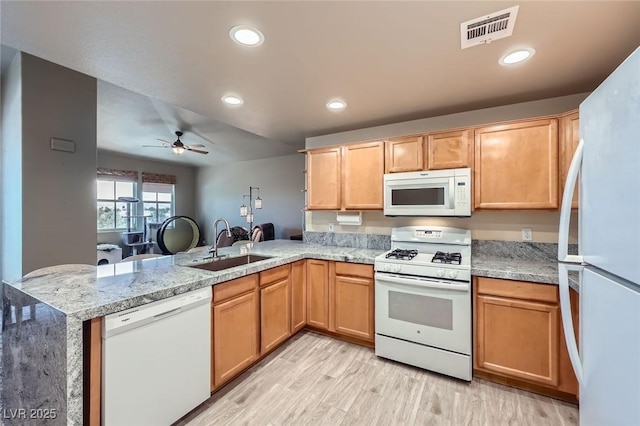 2325 Windmill Pkwy Unit 1622, Henderson, NV 89074 - kitchen featuring white appliances, a peninsula, light wood-type flooring, a ceiling fan, and recessed lighting