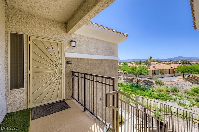 2325 Windmill Pkwy Unit 1622, Henderson, NV 89074 - doorway to property featuring stucco siding, a balcony, and a mountain view