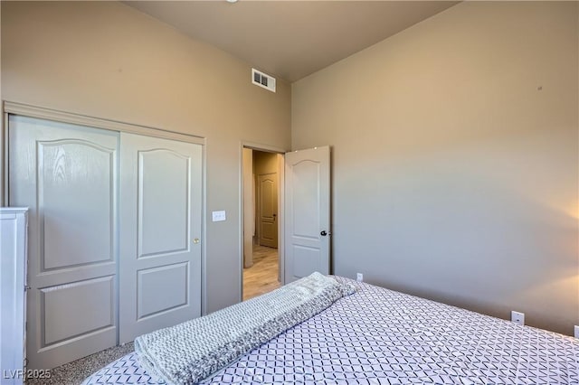 2325 Windmill Pkwy Unit 1622, Henderson, NV 89074 - bedroom featuring a closet, high vaulted ceiling, and carpet