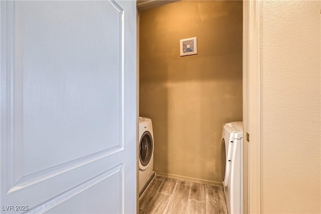 2325 Windmill Pkwy Unit 1622, Henderson, NV 89074 - laundry area featuring washer and dryer and wood tiled floors
