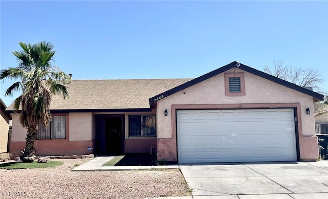 2405 Prime Advantage Ave, North Las Vegas, NV 89032 - ranch-style house with driveway, an attached garage, and stucco siding