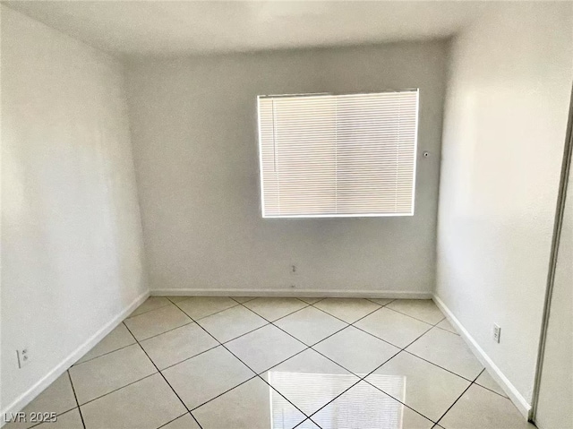 2405 Prime Advantage Ave, North Las Vegas, NV 89032 - empty room featuring light tile patterned floors and baseboards