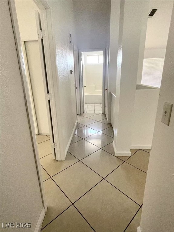 2405 Prime Advantage Ave, North Las Vegas, NV 89032 - corridor with light tile patterned flooring and baseboards