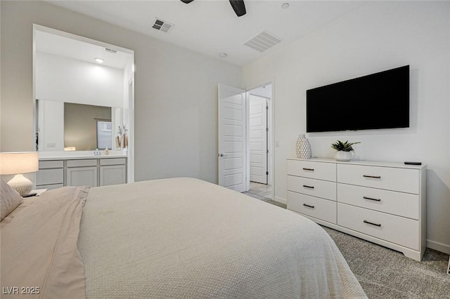 912 Allister Fields Ln, Las Vegas, NV 89138 - carpeted bedroom with connected bathroom and a ceiling fan