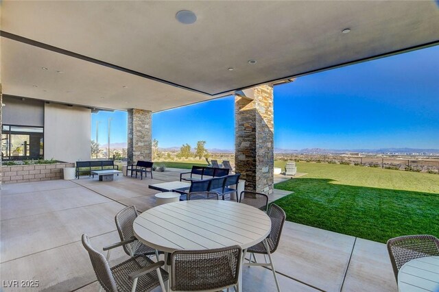 912 Allister Fields Ln, Las Vegas, NV 89138 - view of patio with outdoor dining space and a mountain view