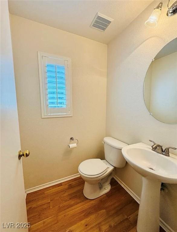 9100 Hombard Ave, Las Vegas, NV 89148 - half bath with toilet and wood finished floors