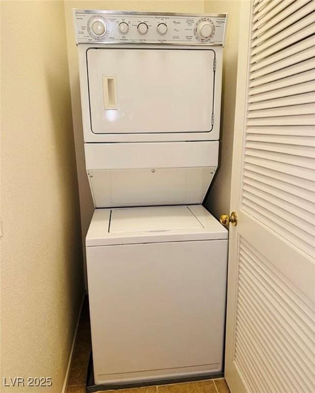 9100 Hombard Ave, Las Vegas, NV 89148 - laundry area with stacked washer / drying machine and tile patterned floors