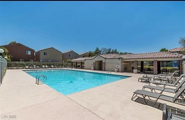 9100 Hombard Ave, Las Vegas, NV 89148 - community pool featuring a patio