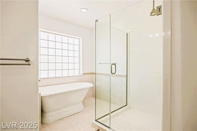1470 St Joseph St, Overton, NV 89040 - full bathroom featuring a stall shower, a freestanding tub, and tile patterned floors