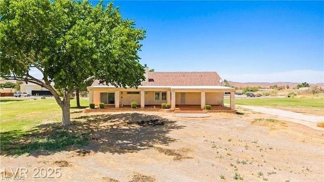 1470 St Joseph St, Overton, NV 89040 - ranch-style house featuring covered porch, stucco siding, and a front lawn