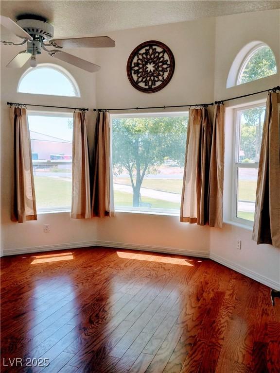 1470 St Joseph St, Overton, NV 89040 - empty room with wood finished floors, a ceiling fan, and a textured ceiling