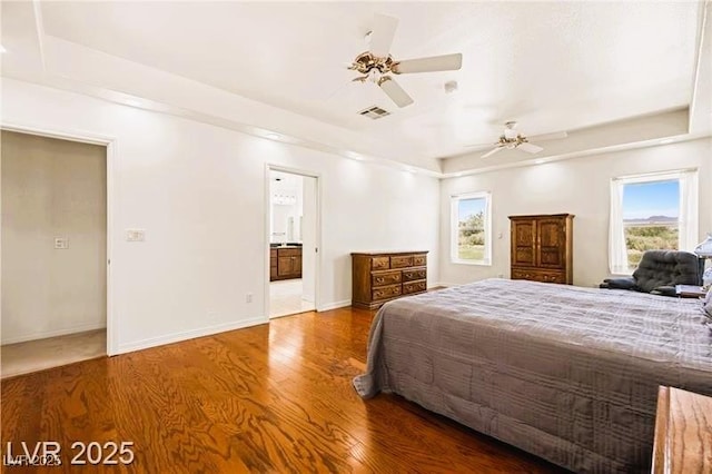 1470 St Joseph St, Overton, NV 89040 - bedroom with wood finished floors, multiple windows, ceiling fan, and ensuite bath