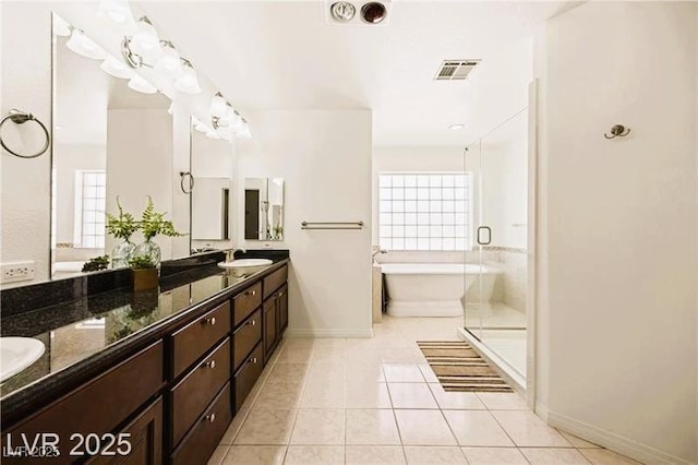 1470 St Joseph St, Overton, NV 89040 - full bath with a soaking tub, double vanity, tile patterned floors, and a shower stall