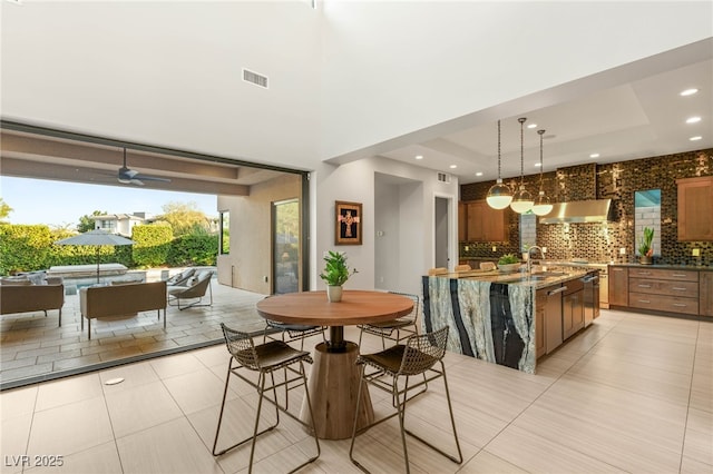 38 Moonfire Dr, Las Vegas, NV 89135 - dining room featuring ceiling fan, light tile patterned floors, recessed lighting, and a raised ceiling
