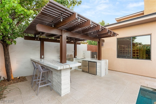 38 Moonfire Dr, Las Vegas, NV 89135 - view of patio with area for grilling and a pergola