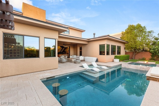 38 Moonfire Dr, Las Vegas, NV 89135 - view of pool with outdoor lounge area, a patio, ceiling fan, and a pool with connected hot tub