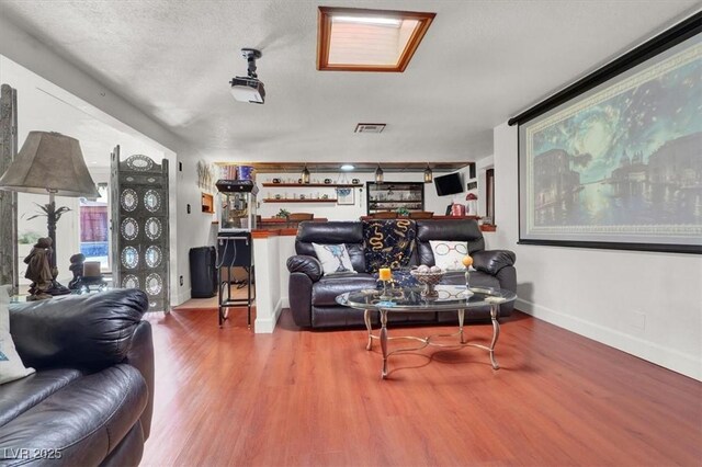 5005 Harmony Ave, Las Vegas, NV 89107 - living room with a dry bar and wood finished floors