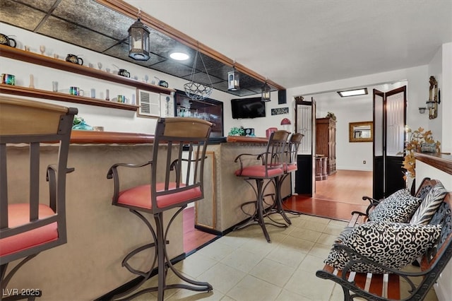 5005 Harmony Ave, Las Vegas, NV 89107 - indoor dry bar with light tile patterned floors