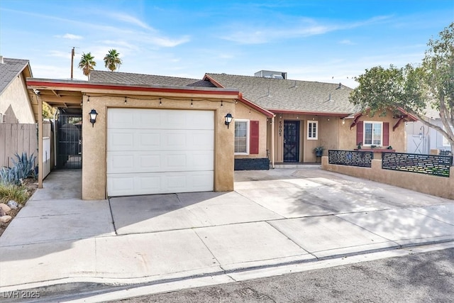 5005 Harmony Ave, Las Vegas, NV 89107 - single story home featuring driveway, stucco siding, a garage, and roof with shingles