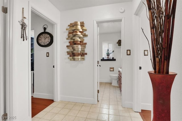 5005 Harmony Ave, Las Vegas, NV 89107 - hall with baseboards and light tile patterned floors