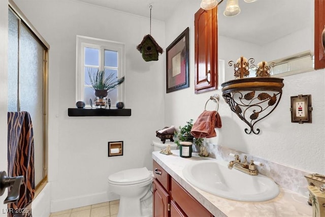 5005 Harmony Ave, Las Vegas, NV 89107 - bathroom with vanity, tile patterned floors, and shower / bath combination with glass door
