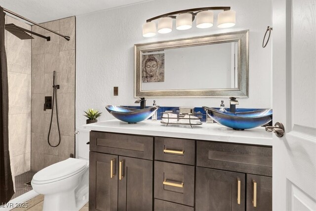 5005 Harmony Ave, Las Vegas, NV 89107 - bathroom with double vanity and a tile shower