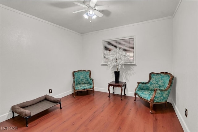 5005 Harmony Ave, Las Vegas, NV 89107 - sitting room featuring ceiling fan, wood finished floors, and ornamental molding