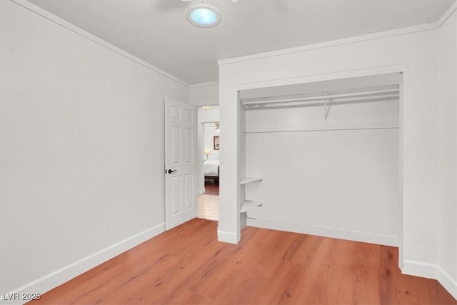 5005 Harmony Ave, Las Vegas, NV 89107 - unfurnished bedroom with wood finished floors, ornamental molding, and a closet