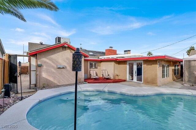 5005 Harmony Ave, Las Vegas, NV 89107 - view of swimming pool featuring french doors and a gate