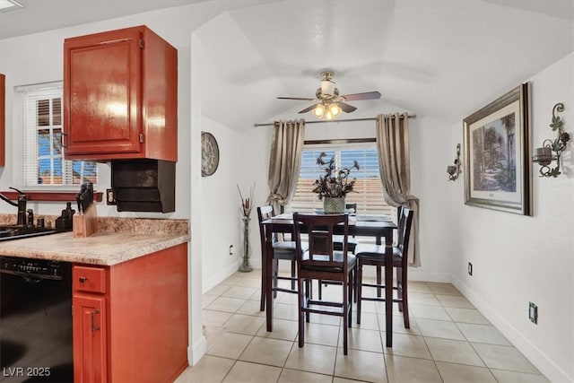 5005 Harmony Ave, Las Vegas, NV 89107 - dining room featuring ceiling fan, vaulted ceiling, and light tile patterned floors