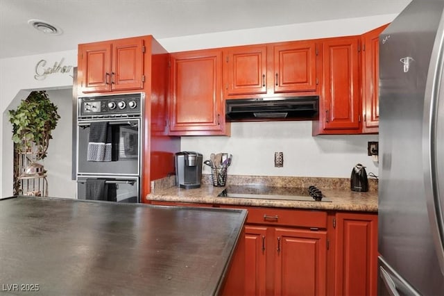 5005 Harmony Ave, Las Vegas, NV 89107 - kitchen with black appliances and under cabinet range hood