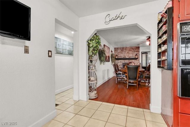 5005 Harmony Ave, Las Vegas, NV 89107 - corridor featuring light tile patterned flooring and baseboards