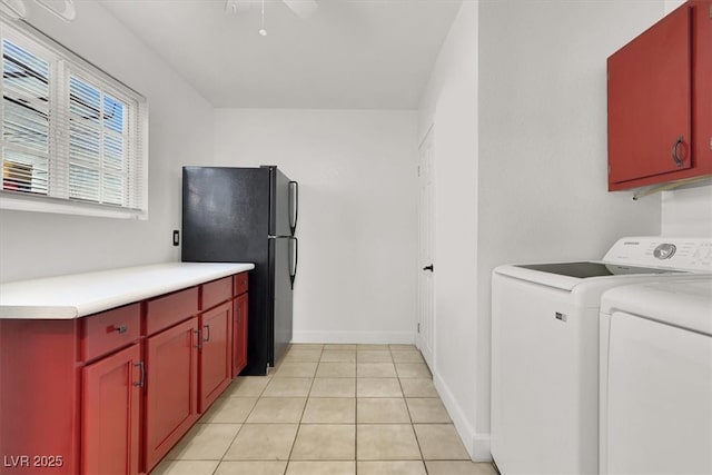 5005 Harmony Ave, Las Vegas, NV 89107 - laundry room with washer and clothes dryer and light tile patterned floors