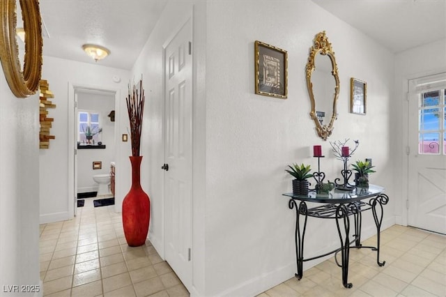 5005 Harmony Ave, Las Vegas, NV 89107 - corridor with light tile patterned floors and baseboards