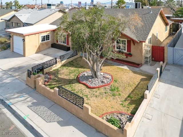 5005 Harmony Ave, Las Vegas, NV 89107 - ranch-style house featuring stucco siding, driveway, a shingled roof, a gate, and a garage