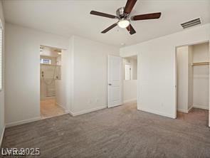 1891 Via Del Prado St, Las Vegas, NV 89115 - unfurnished bedroom with connected bathroom, a ceiling fan, a closet, and carpet