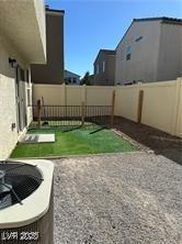 1891 Via Del Prado St, Las Vegas, NV 89115 - fenced backyard with a patio