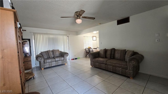 5209 Del Monte Ave, Las Vegas, NV 89146 - living room with ceiling fan, light tile patterned flooring, and a textured ceiling