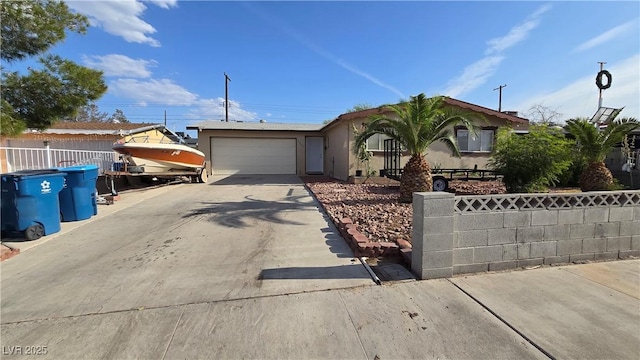 5209 Del Monte Ave, Las Vegas, NV 89146 - view of front facade featuring concrete driveway, an attached garage, and stucco siding