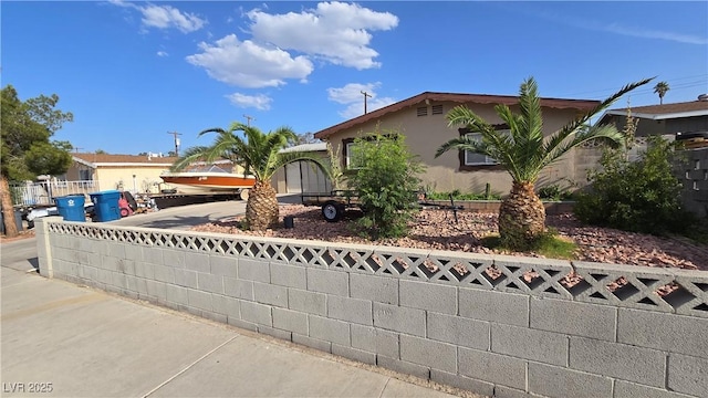 5209 Del Monte Ave, Las Vegas, NV 89146 - view of property hidden behind natural elements featuring stucco siding