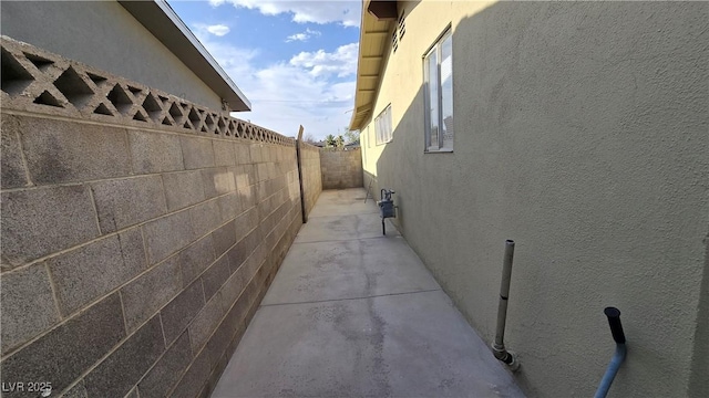 5209 Del Monte Ave, Las Vegas, NV 89146 - view of side of home with stucco siding and a patio area