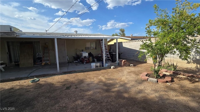 5209 Del Monte Ave, Las Vegas, NV 89146 - back of property with a patio and a fenced backyard